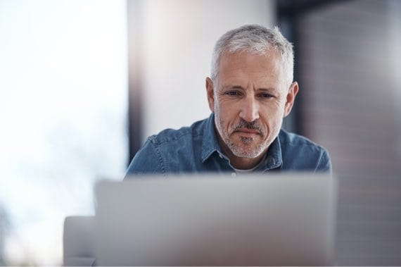 Man Focusing on Laptop