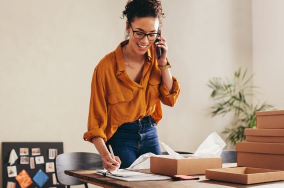 A woman working over a business phone