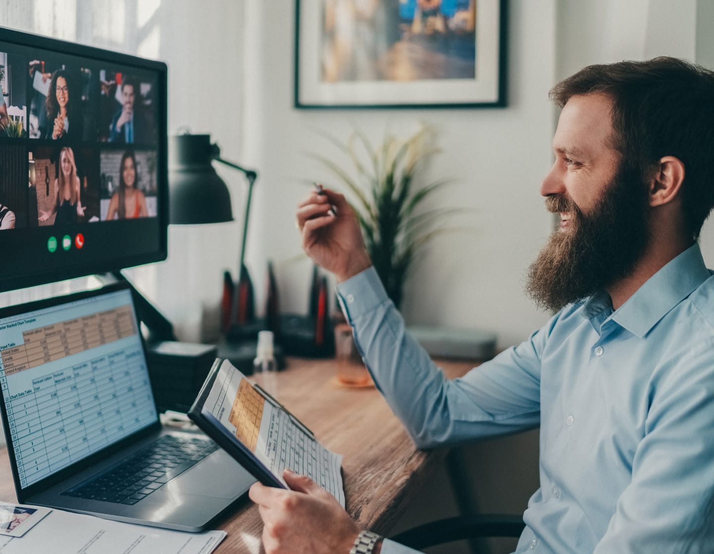 A man on a conference call from his computer at home