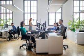 Employees working at desks in a modern office