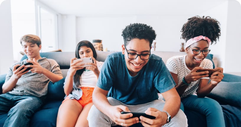 friends in living room playing video games