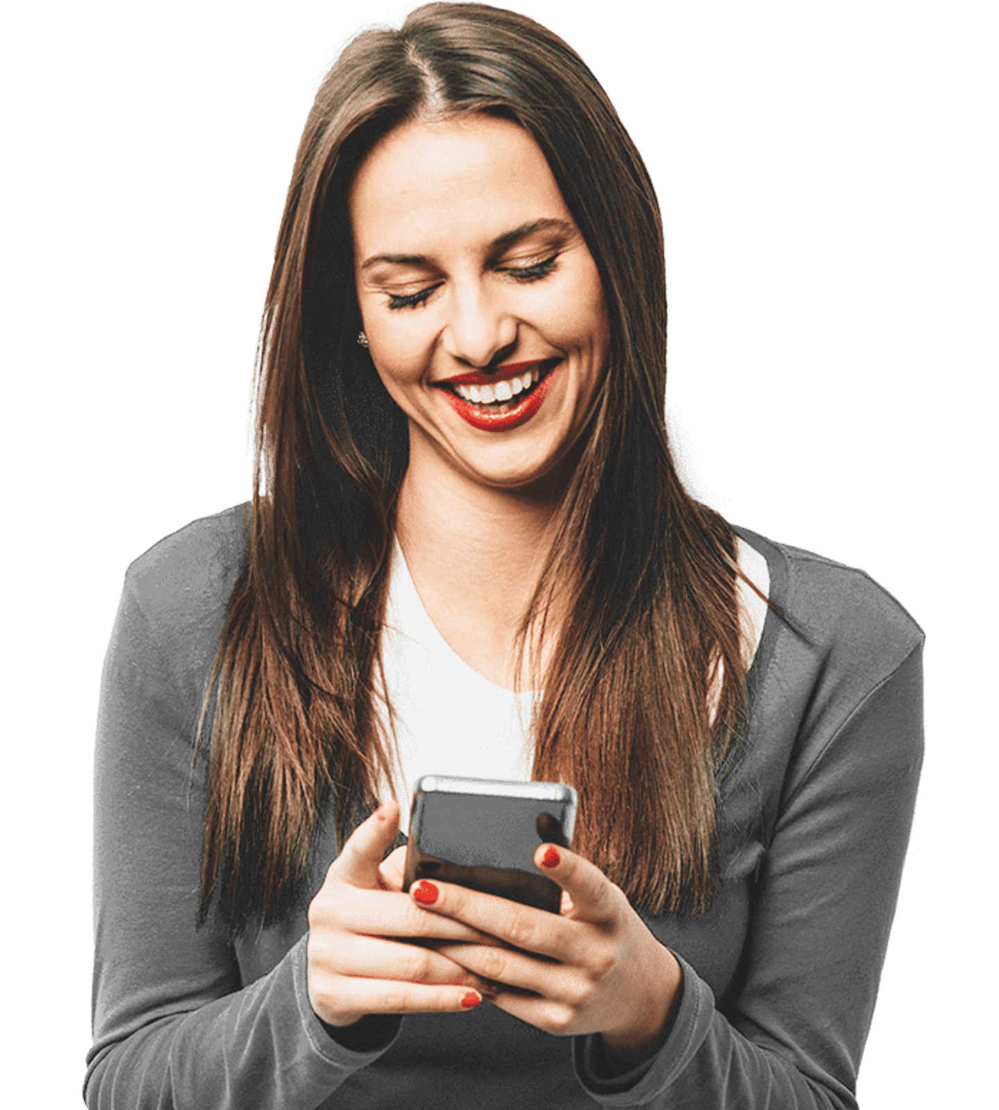 A person smiling and looking down at their phone