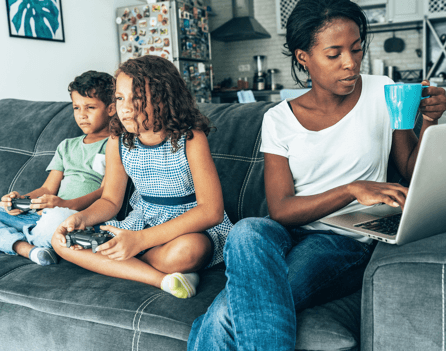a family sitting on a couch