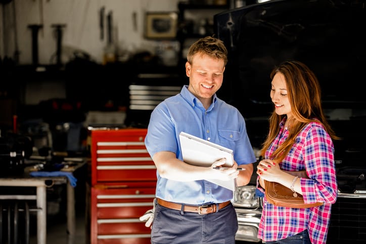 mechanic talking to client