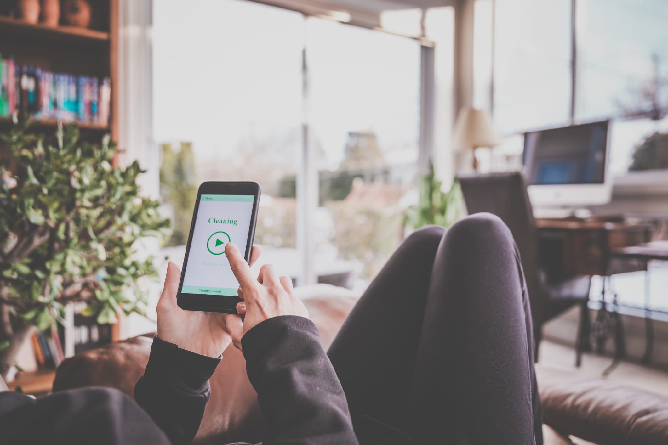 person using cellphone at home