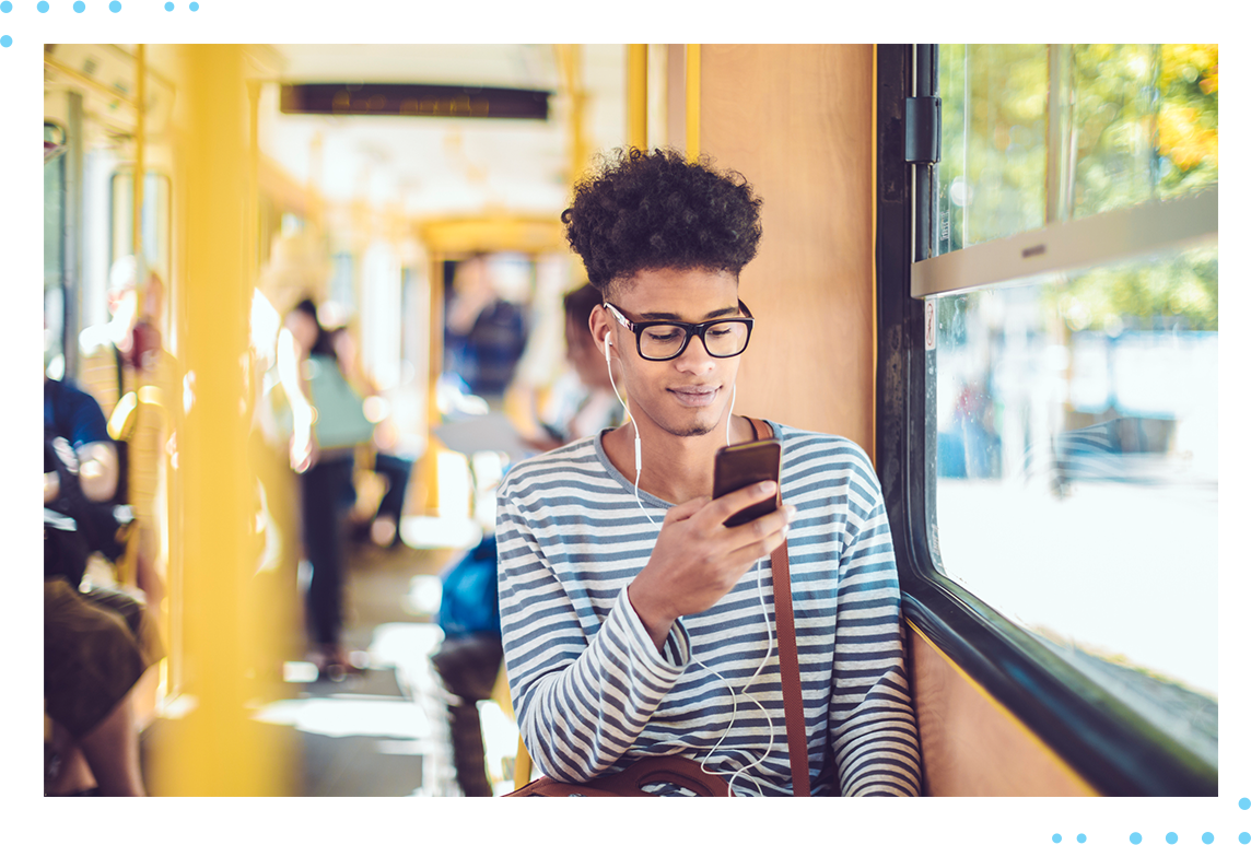 man on train using phone