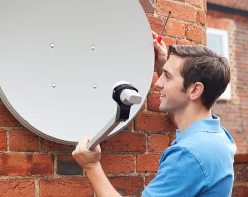 Man installing a satellite