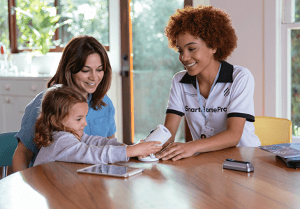 family holding tablet