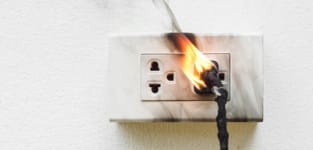 outlet and plug on fire