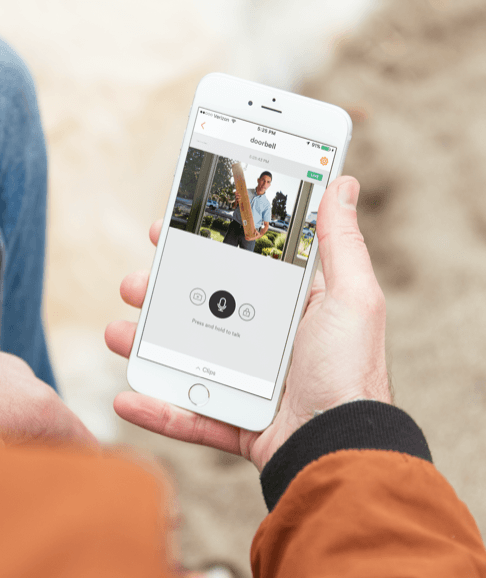 person looking at their doorbell feed on the vivant smart home app