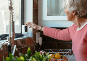 senior couple using the Vivint app and camera