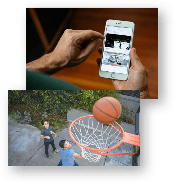 Father recording video clips using Vivint Playback™ of two sons playing basketball.