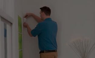 Home security professional installing keypad