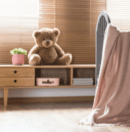 Teddy bear sitting on shelf