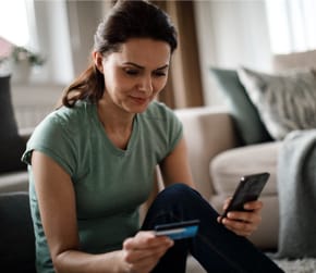 image of woman with phone and credit card