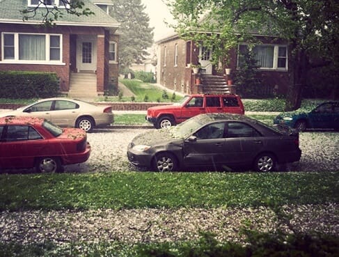 Cars being ruined by a hailstorm