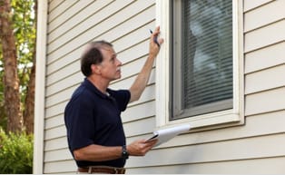 Image of man inspecting windows