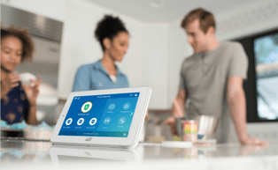 Image of customer and rep with tablet on table